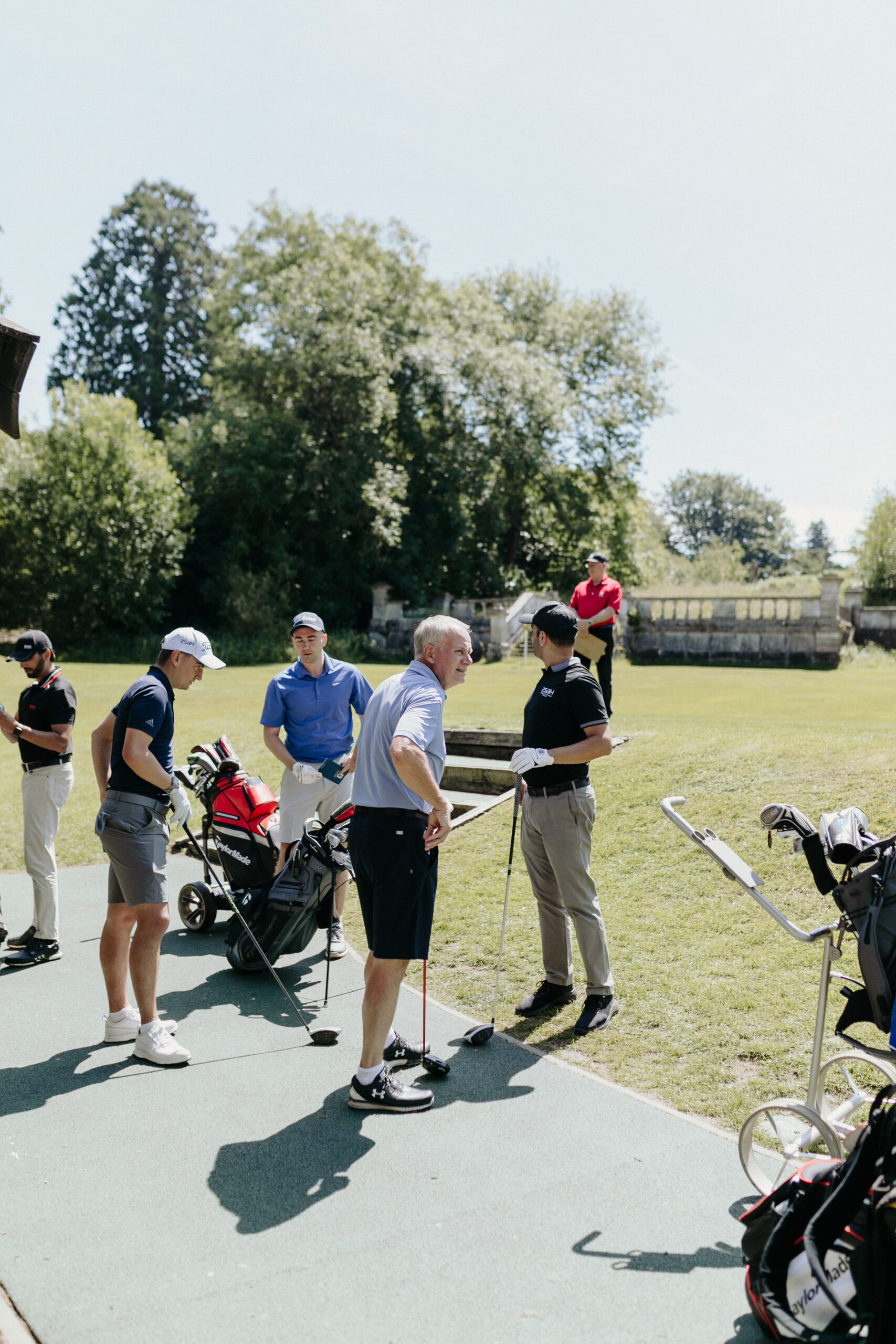 golf_pic12_guestsoncourt_standing Group of men getting ready to go out and play golf